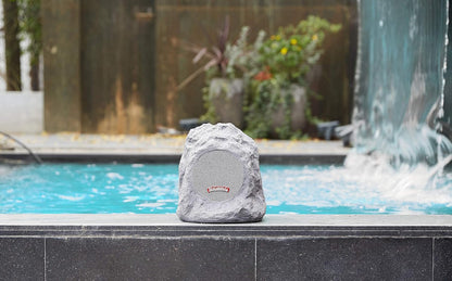 Margaritaville Outdoor Rock Bluetooth Wireless Speaker | Durable Bluetooth Speakers, Fantastic Yard or Patio Decor, IPX-4 Waterproof Rated, Granite Grey “On the Rock”